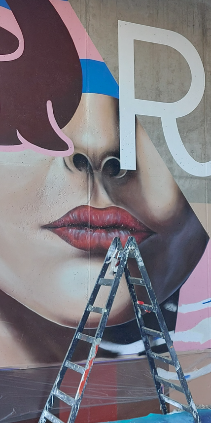 Mural in progress — detail of a painting in public space